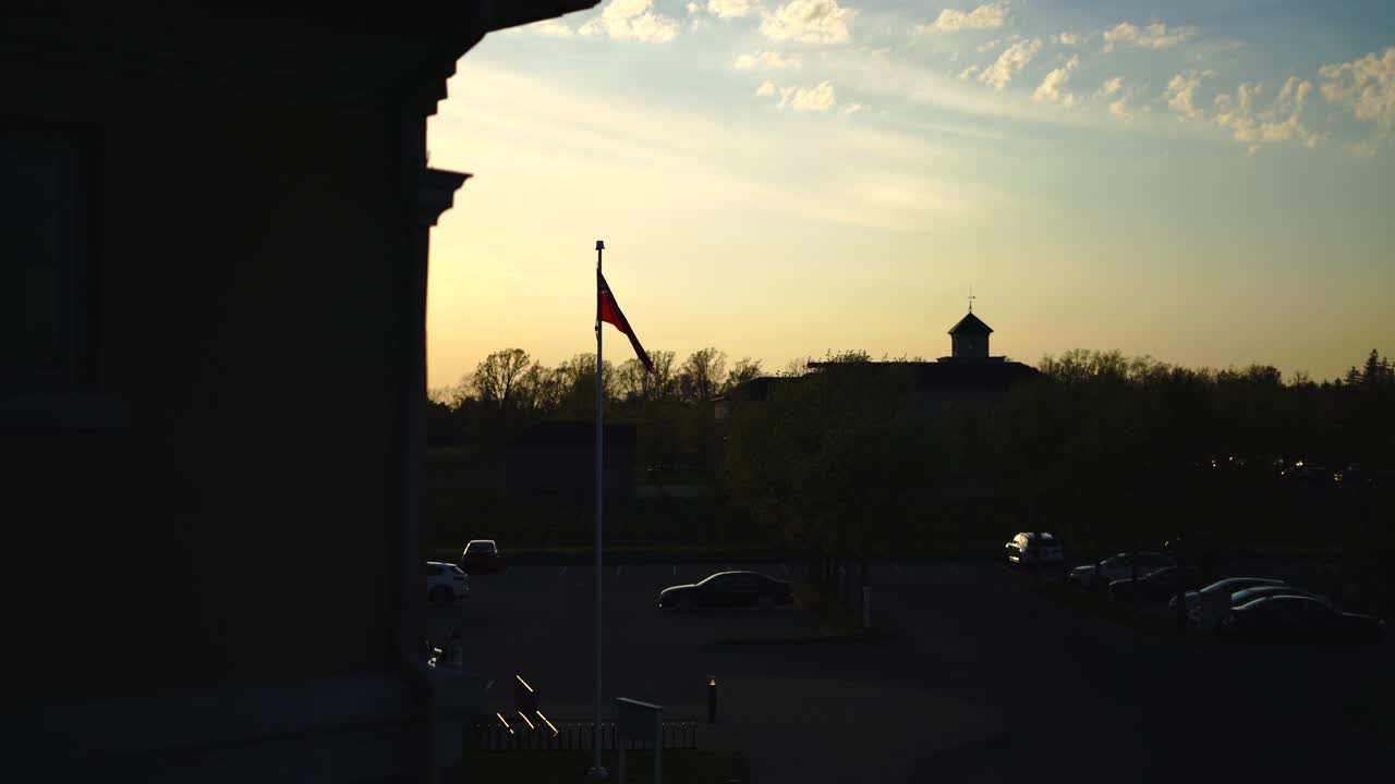 Ontario, Canada provincial flag waving during sunset golden hour