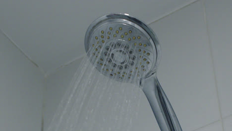 close-up of a modern shower head spraying water