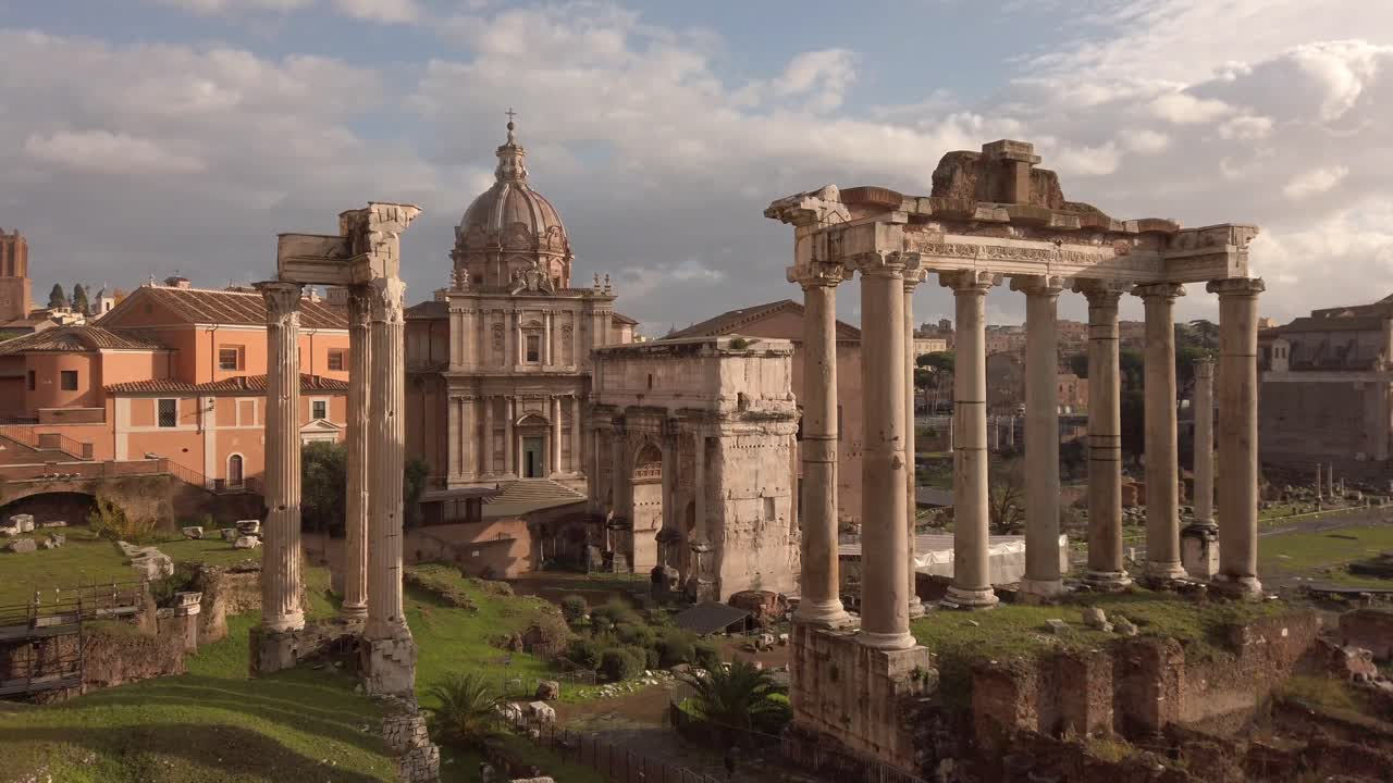 View on the Roman Forum with its iconic ruins in the center of the city of Rome, capital of Italy. Static shot.