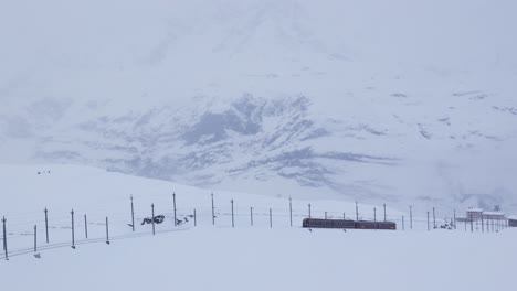 Cinematic-footage-of-the-gonergrat-railway-in-the-horizon-with-the-matterhorn-in-its-backdrop