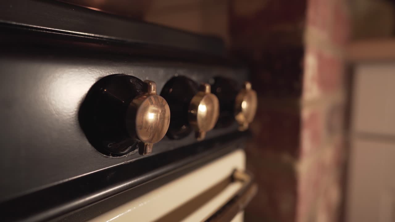 Premium stock video - Close up view of old kitchen fire knobs oven