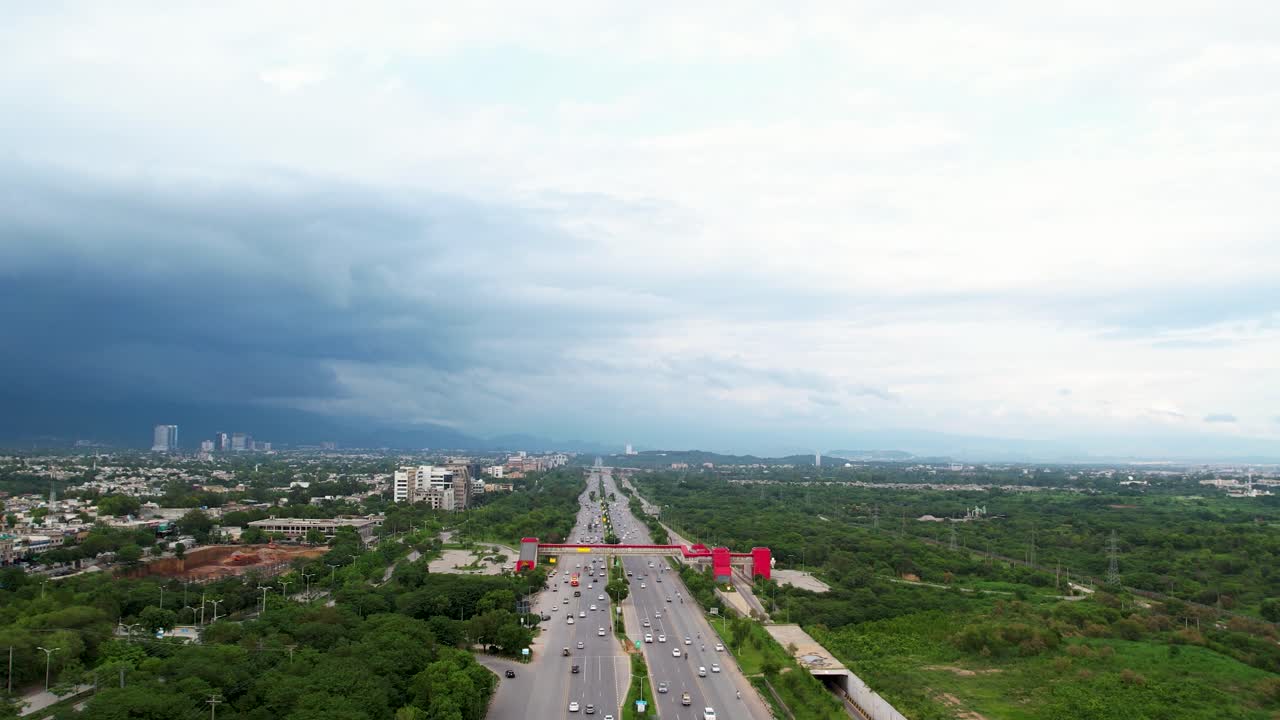 Islamabad Aerial View - Amazing drone shot of Kashmir highway in Islamabad Capital of Pakistan, busy traffic roads and bridges during the daytime