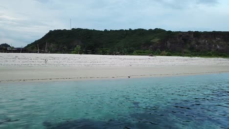 aerial 4k beautiful isolated beach with blue waters, indonesia