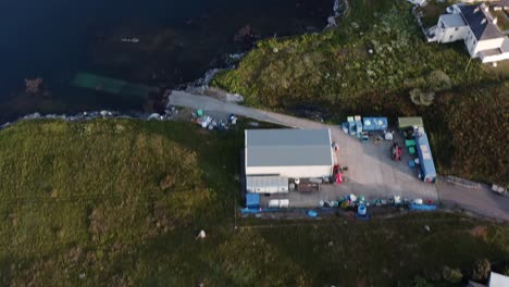 Tilting-drone-shot-of-Lochmaddy,-showing-the-Lochmaddy-to-Uig-ferry-run-by-Caledonian-Macbrayne