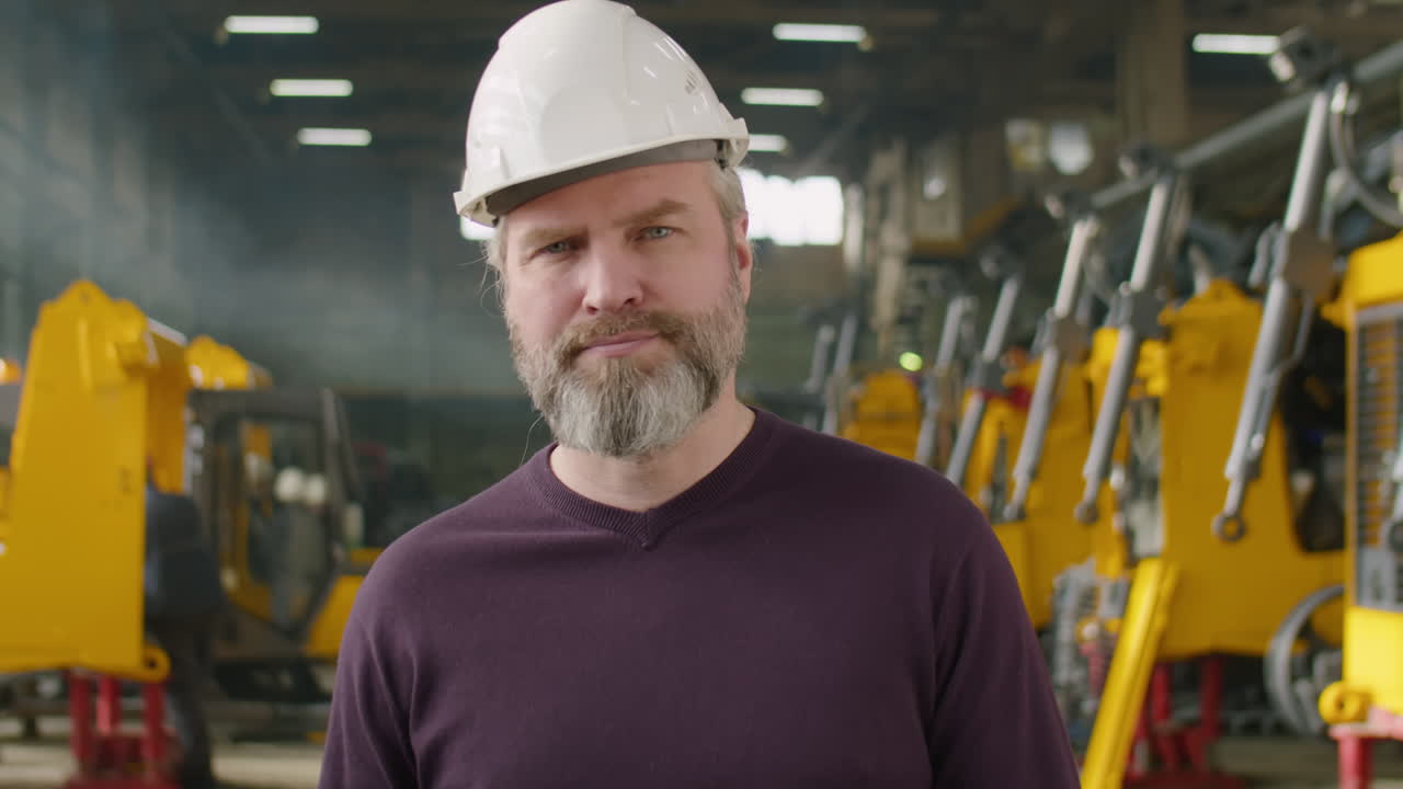 Portrait of Senior Engineer at Heavy Machinery Factory