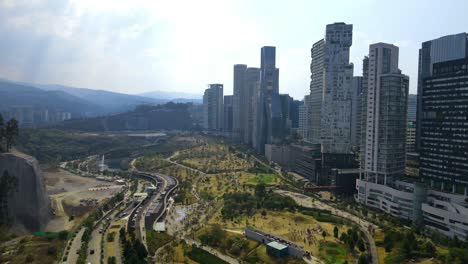 Santa-Fe-Mexico-City-Business-Destrict,-Drone-Shot,-Skyscraper,-Skyline,-Park