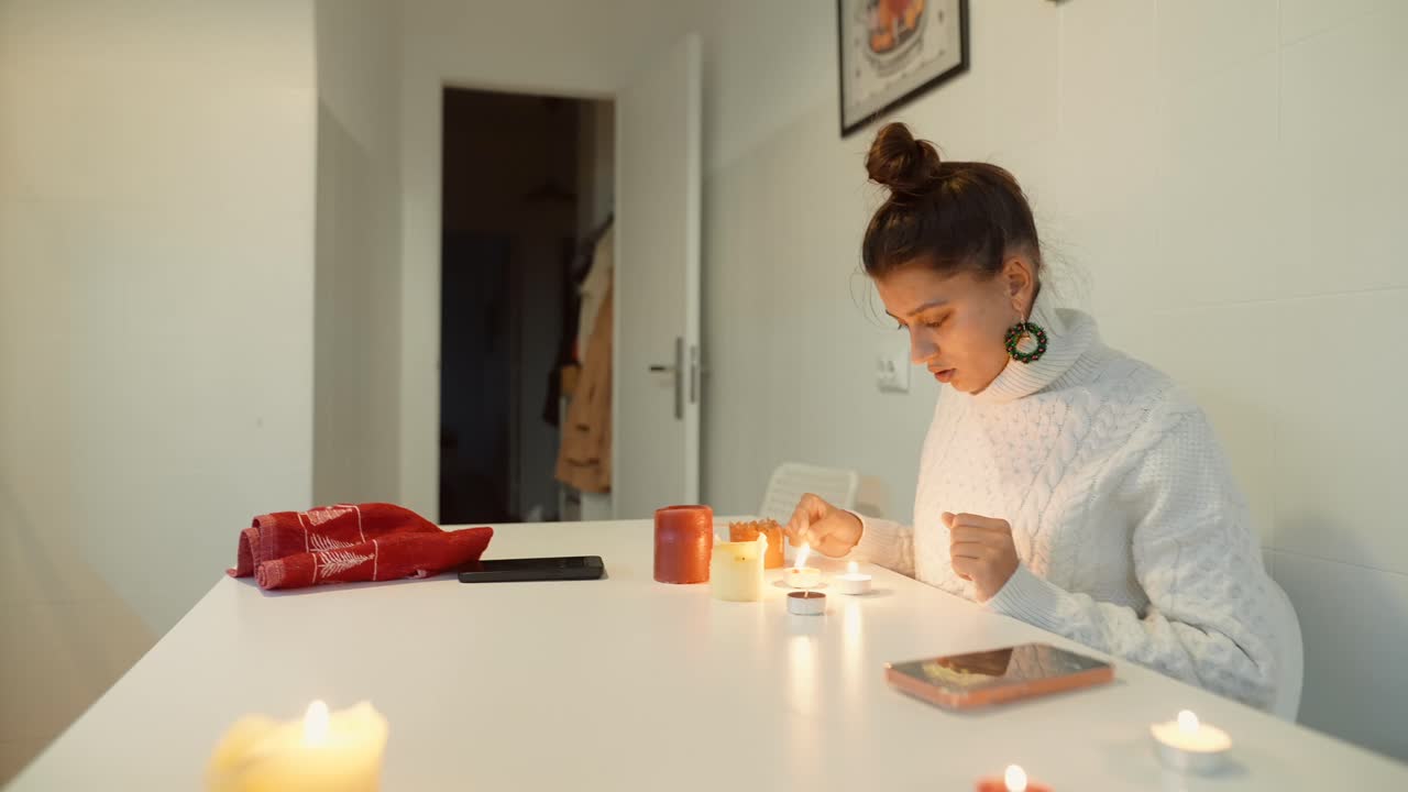 Woman lighting candles