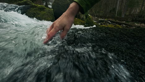 hand in a mountain stream