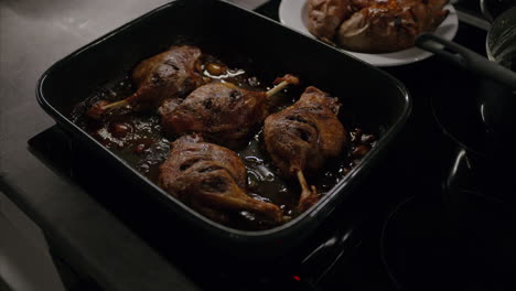 sizzling roasted duck leg fresh out of the oven, healthy fat, oily food, delicious lunch, dinner, cooking at home, grilled fried meat, high calorie food, cooking, traditional european christmas dish