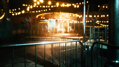 a blurred image of a carousel at night