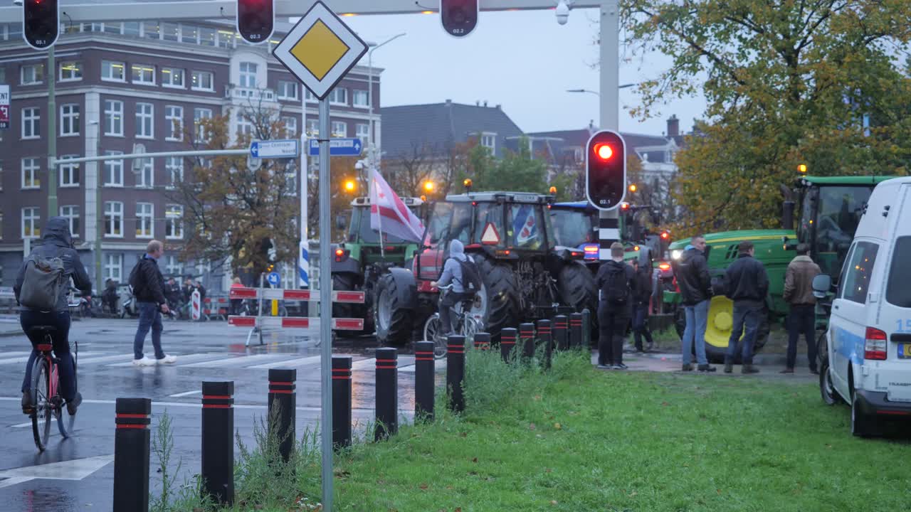 Tractors on the public road at Malieveld, The Hague during the farmers protests in October, 2019. Biggest traffic jam caused by farmers in The Netherlands. Slow motion in sixty frames per second.