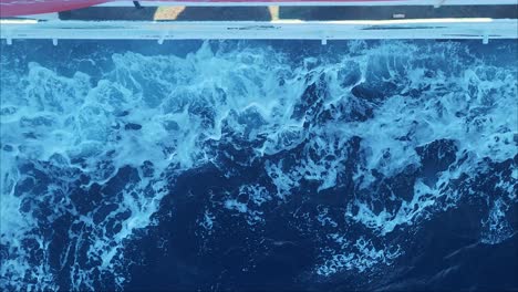Water Bow Breaks of Sea Waves of Water Surface. Crashing Waves Bow of a Cargo Vessel Shipping Sailing Water Travel Boat. Boat Breaking Waves.