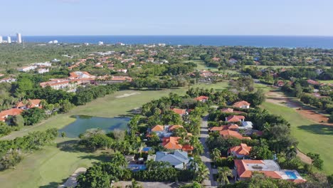 panoramic aerial view over the exclusive metro country club, juan dolio