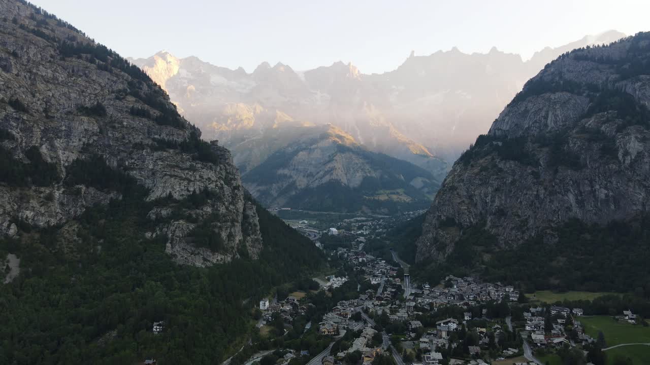 Aerial View of a Scenic Mountain Valley Town at Sunset