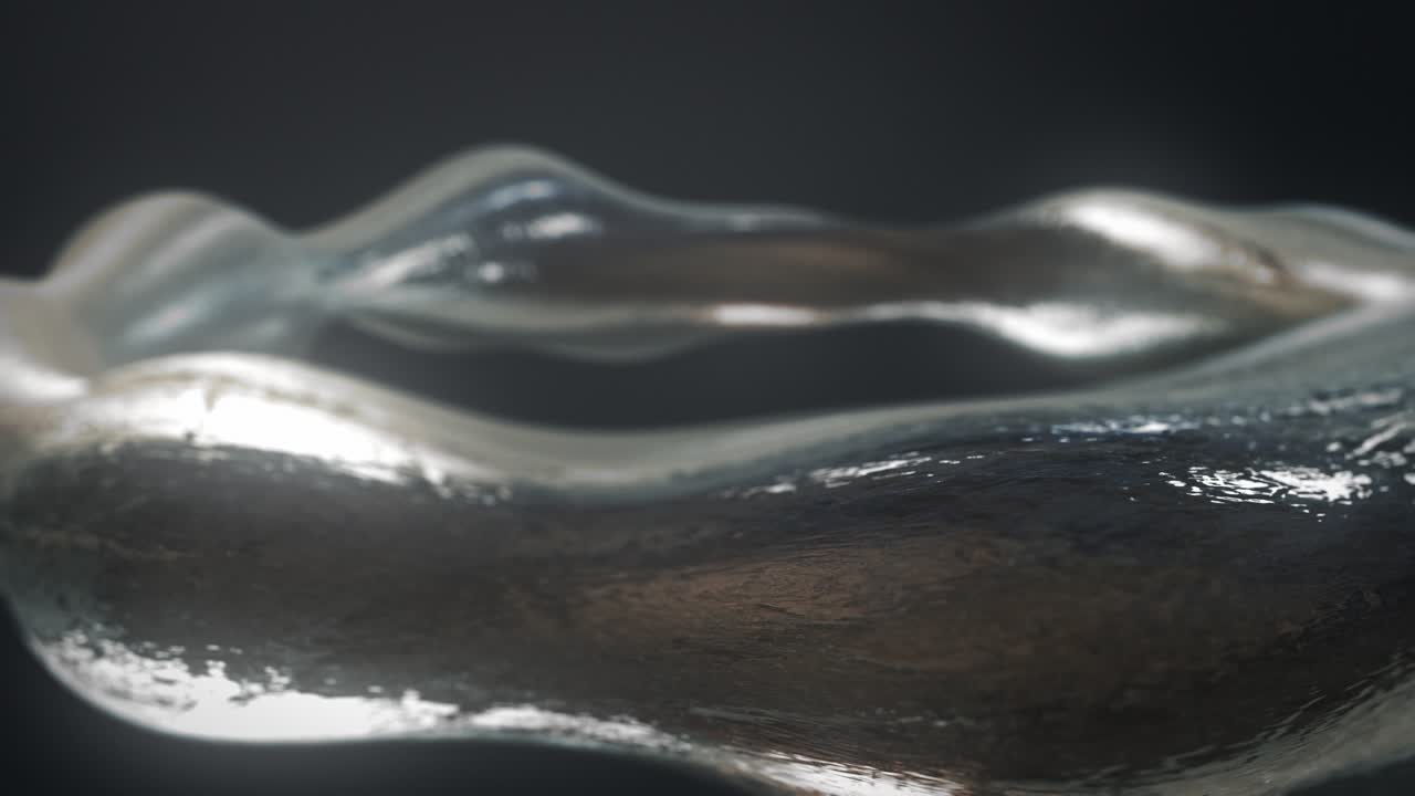 파동형 디자인으로 회전하는 은 금속 팔