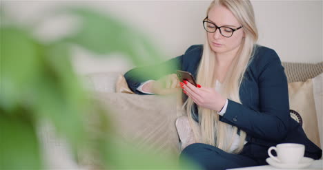 Woman-Browsing-Social-Media-On-Smartphone