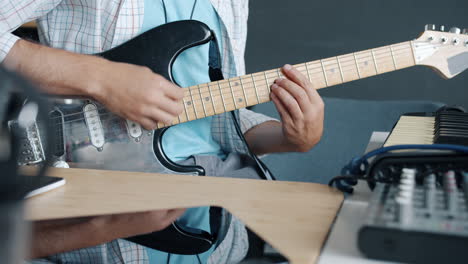 Musician Playing Electric Guitar in Recording Studio