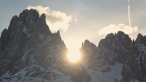 captivating footage of the sun rising over the jagged peaks of the dolomites, creating a stunning silhouette