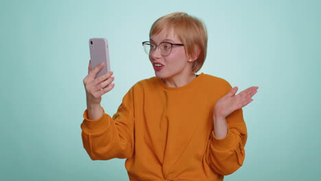 young woman traveler blogger taking selfie on smartphone communicating video call online stream