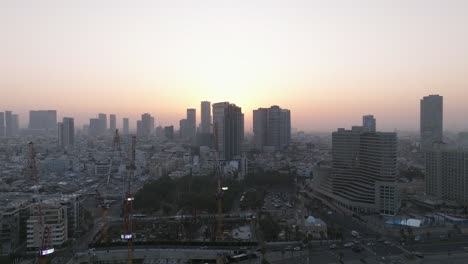 tel aviv coastline at sunrise with beautiful calm waters of the mediterranean sea, waterfront hotels and light sun flare