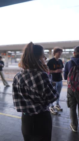 young woman at train station