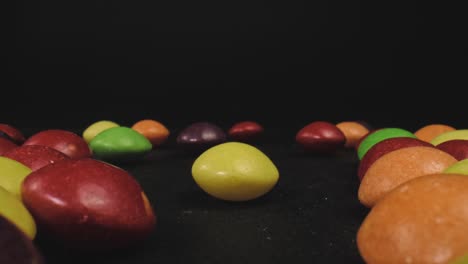 slow dolly zoom out of many skittles candies