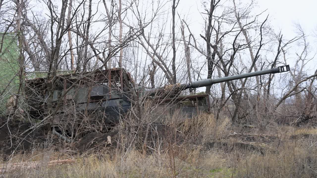 A Ukrainian PzH 2000 self-propelled howitzer emerges from its hidden firing position. The German-made artillery is preparing for a strike against Russian targets during the ongoing war