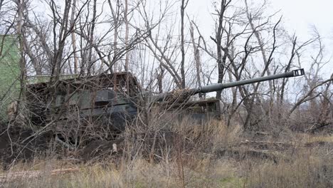 a ukrainian pzh 2000 self-propelled howitzer emerges from its hidden firing position. the german-made artillery is preparing for a strike against russian targets during the ongoing war
