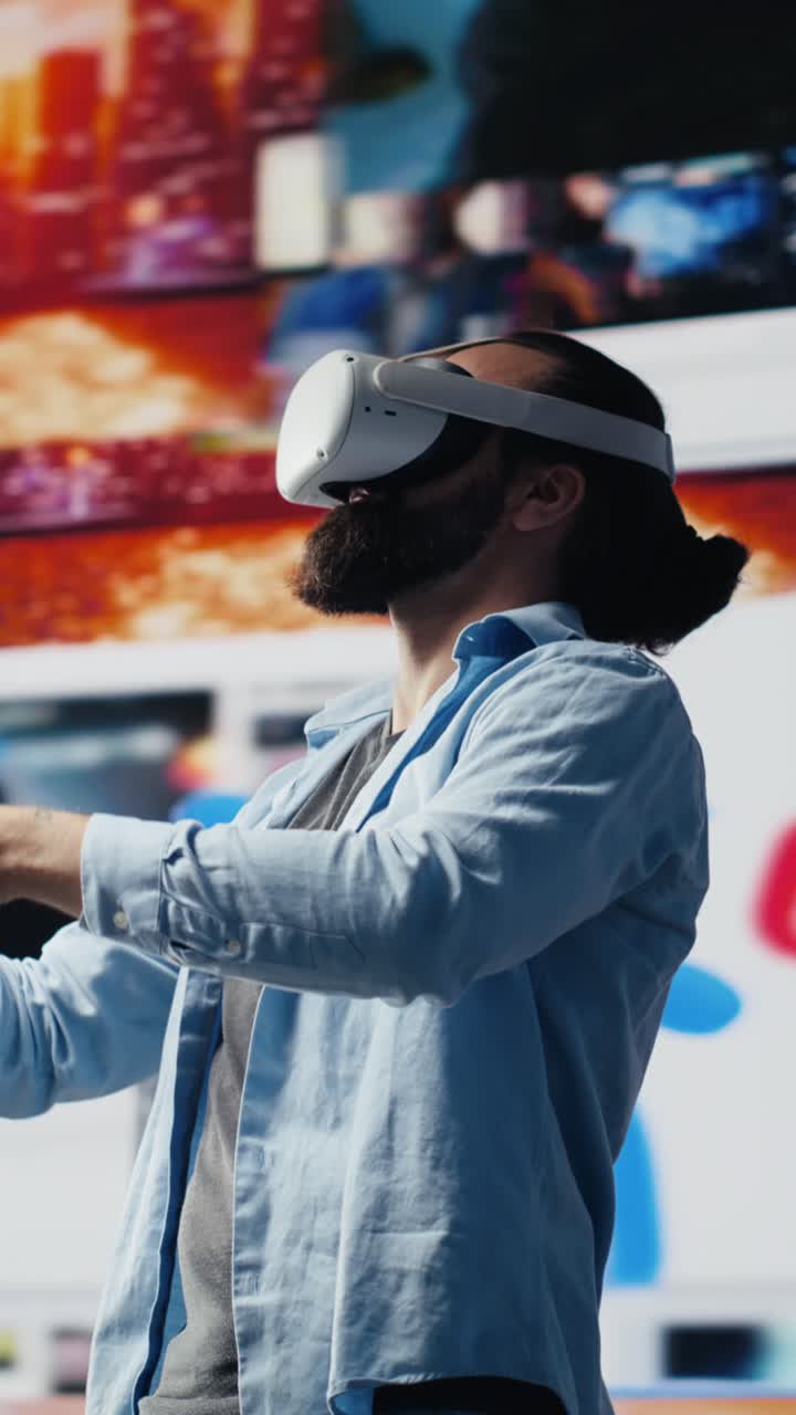 Vertical Video Modern cool man uses virtual reality glasses for a 3d web connection