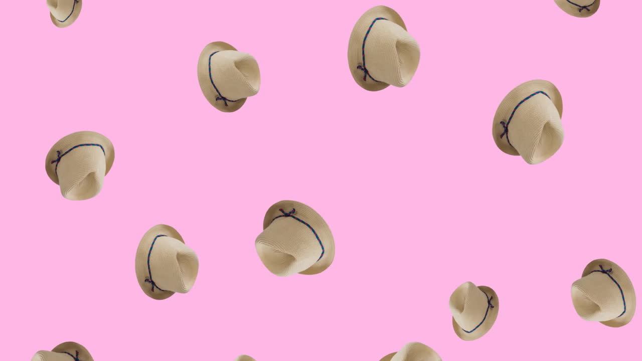 animación de sombreros de paja sobre un fondo rosado