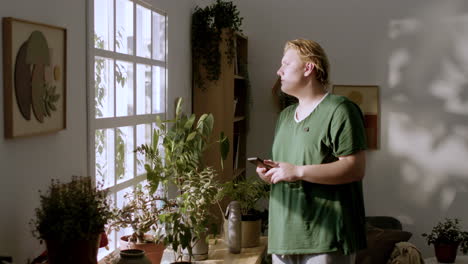 young man looking out of the window