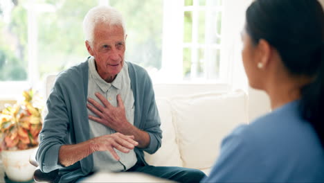 senior man with headache talking to nurse