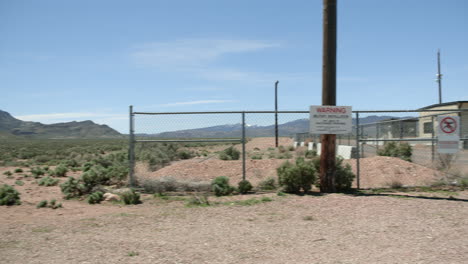 guarded entrance at area 51. nevada. panning shot