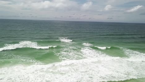 Aerial-view-of-Ocean-Splashing-Waves---Wavy-Sea-Waters-With-White-Foam---drone-shot