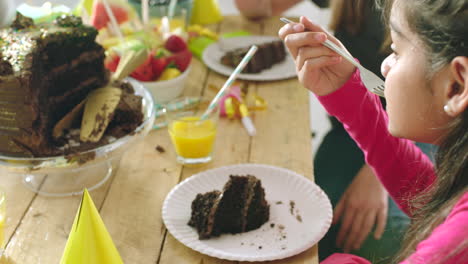 kids enjoying birthday cake