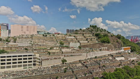 low angle drone aerial view of tsuen wan chinese cemetery in hong kong