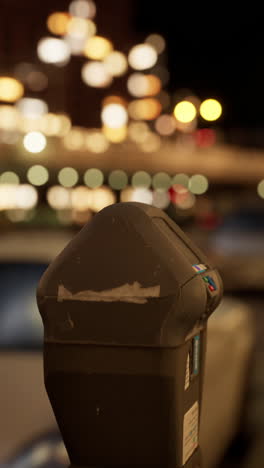 close-up of a parking meter at night