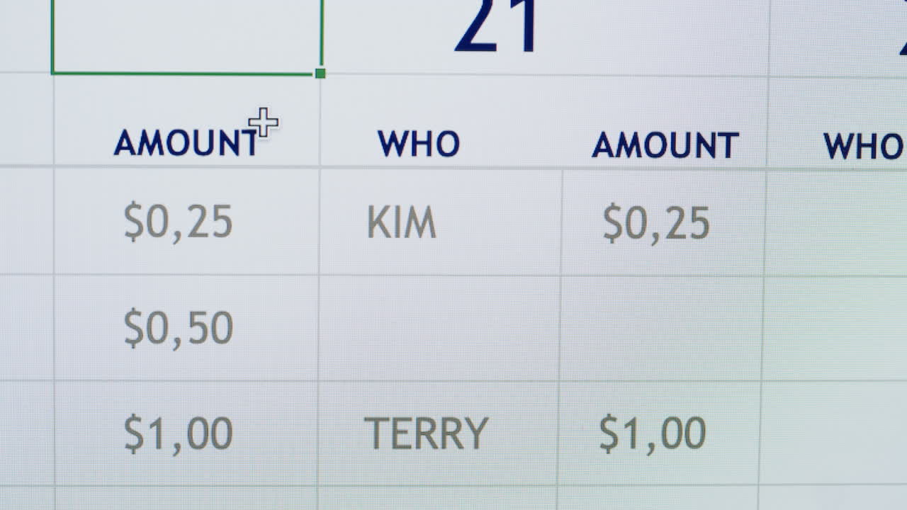 Mouse Cursor Navigating Financial Data on a Digital Spreadsheet
