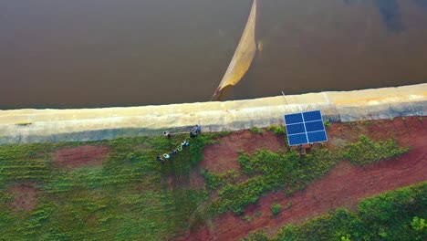 fish farmers netting their fish in africa