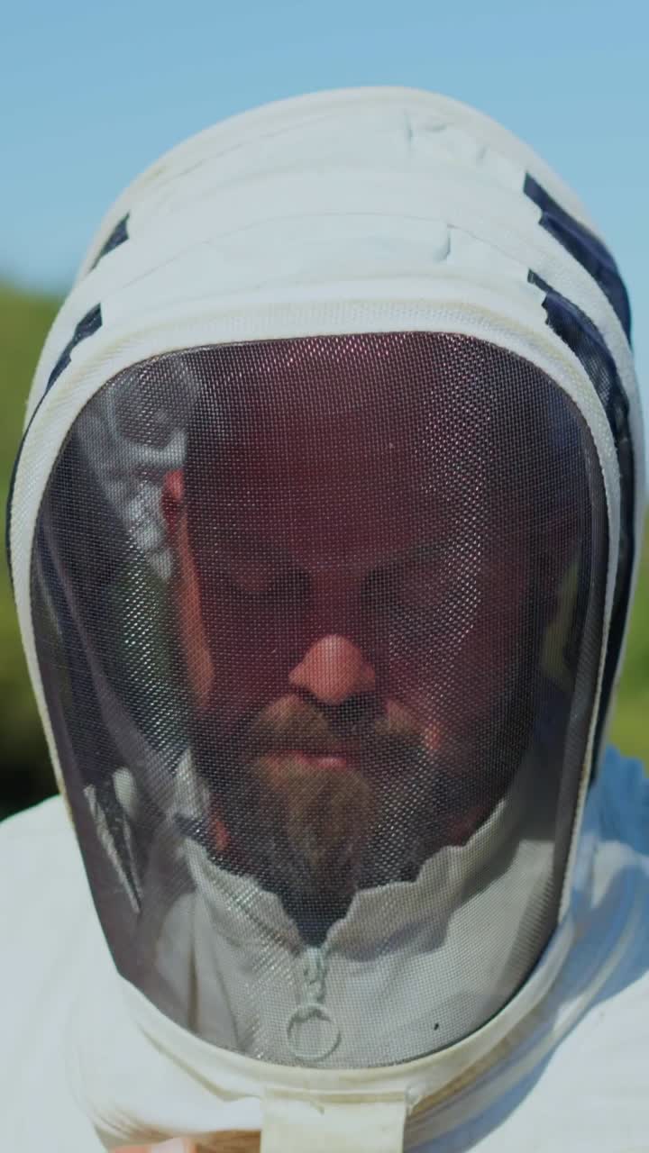 A Beekeeper in Protective Gear