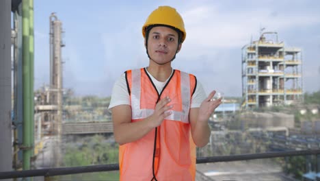 indian construction labour talking to someone