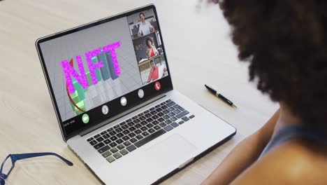 African-american-businesswoman-using-laptop-for-video-call-with-diverse-business-colleagues