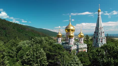 shipka memorial church, memorial temple of the birth of christ with green trees in foreground