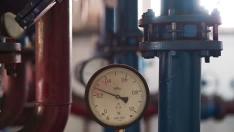 Pressure-meter-on-hot-steam-pipe-in-mechanical-premise