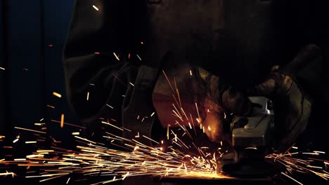 female welder working at work shop