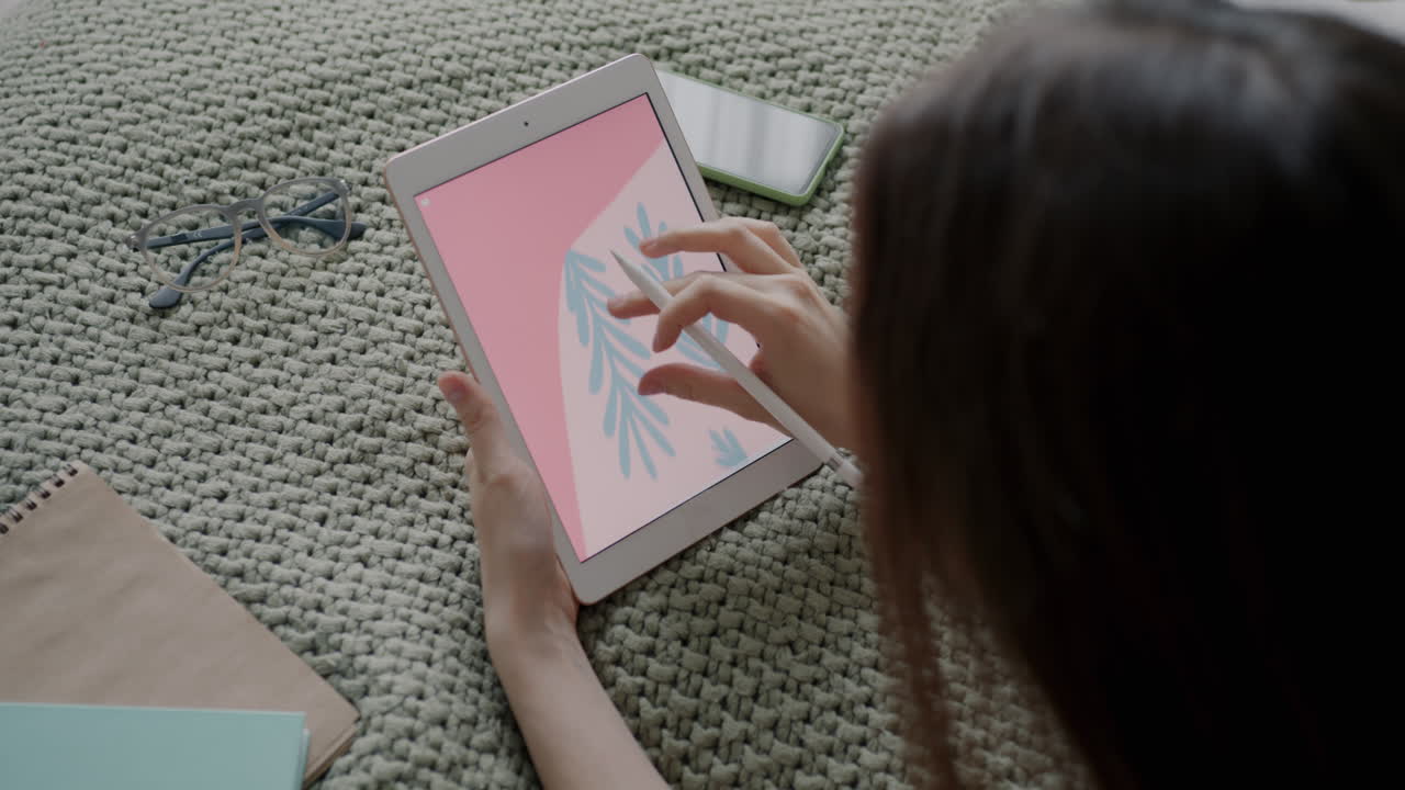 Woman Drawing on Tablet