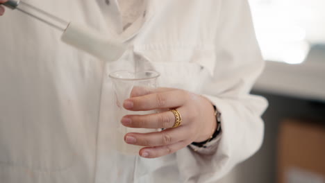 a woman in a laboratory preparing a cream for analysis