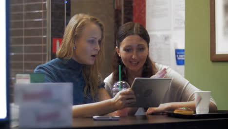 Friends-Watching-Photos-in-Tablet-PC