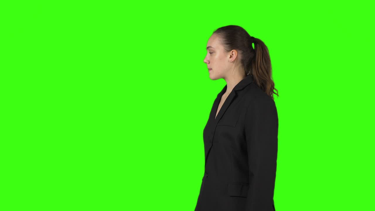 Video of young beckoning woman by forefinger in black jacket