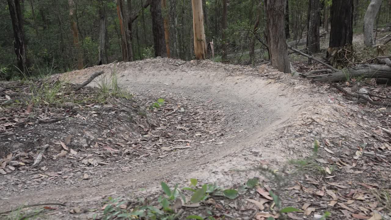 Pedestal up shot of mountain bike singletrack corner (berm) on a mountain bike trail in Queensland, Australia.